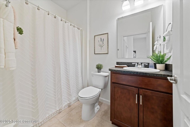 bathroom featuring a shower with shower curtain, vanity, toilet, and tile patterned floors