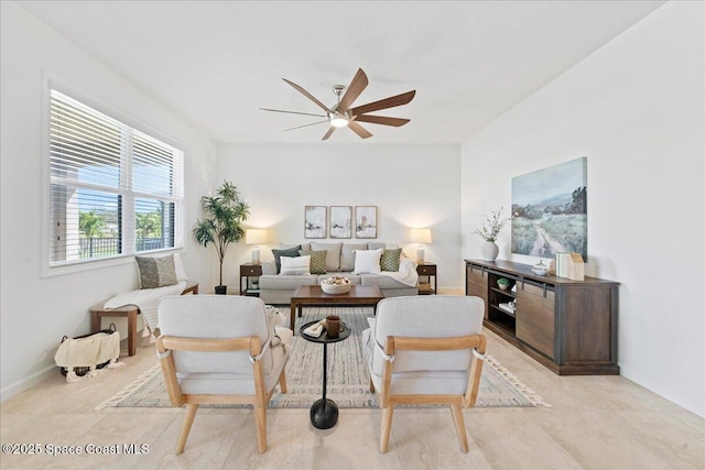 living room featuring a ceiling fan