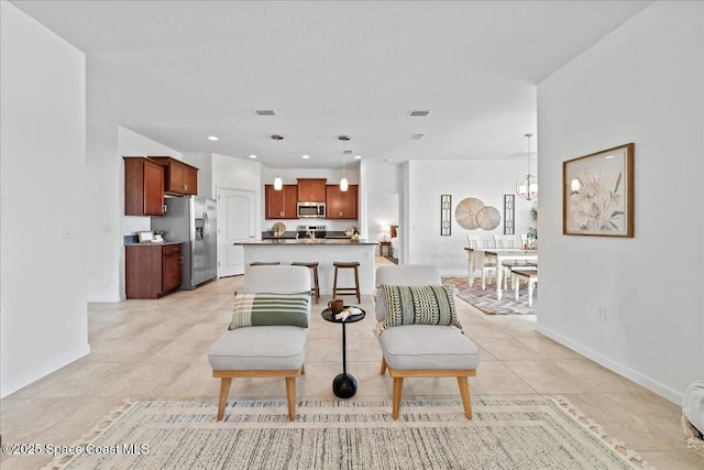 living room featuring recessed lighting, visible vents, baseboards, and light tile patterned floors