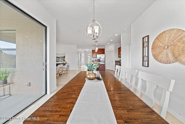 dining area with a notable chandelier and recessed lighting