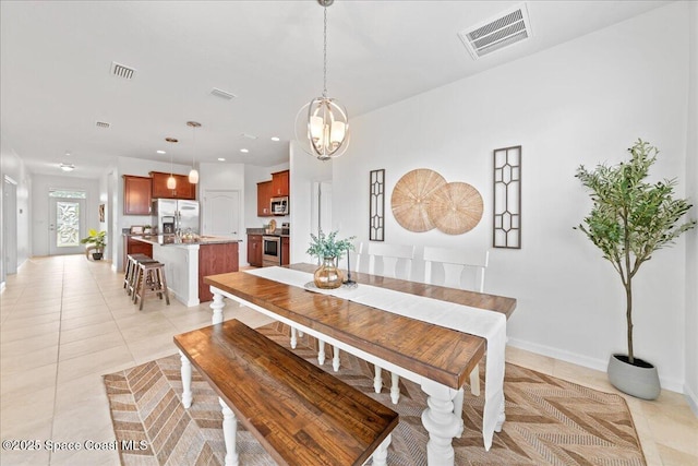 dining room with baseboards, light tile patterned flooring, visible vents, and recessed lighting