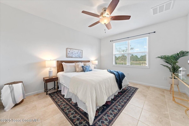 bedroom featuring light tile patterned floors, baseboards, visible vents, and ceiling fan