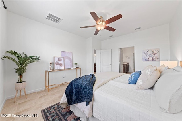 bedroom featuring ceiling fan, connected bathroom, visible vents, and baseboards