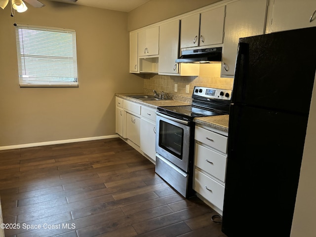 1341 S Patrick Dr, Satellite Beach, FL 32937 - kitchen with stainless steel electric range oven, decorative backsplash, freestanding refrigerator, a sink, and under cabinet range hood