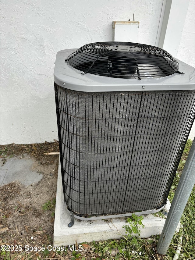 1341 S Patrick Dr, Satellite Beach, FL 32937 - exterior details with central AC and stucco siding