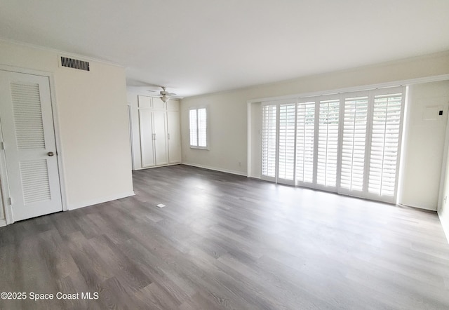 unfurnished living room with ceiling fan, wood finished floors, and visible vents