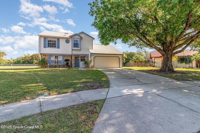 view of front of house featuring a garage, concrete driveway, fence, a front yard, and brick siding