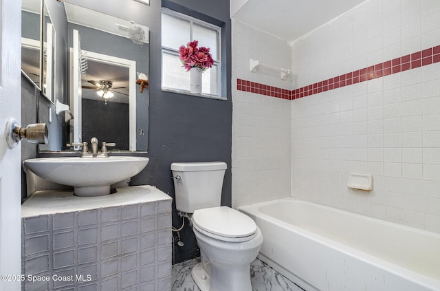 full bathroom with toilet, marble finish floor, tub / shower combination, and a sink