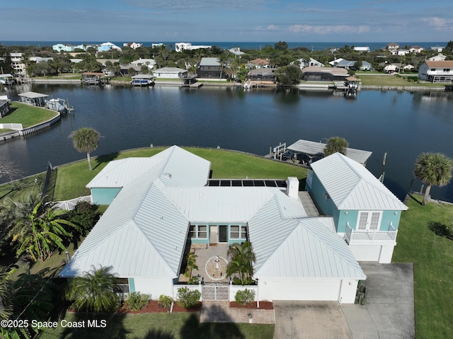 drone / aerial view with a water view