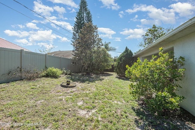 view of yard with a fenced backyard