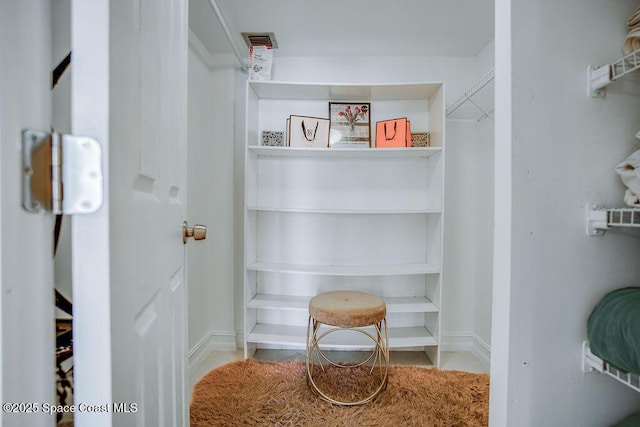 walk in closet with visible vents