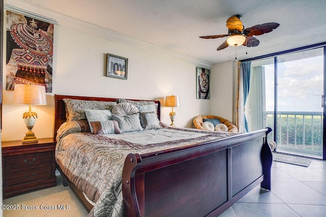 bedroom with ceiling fan, light tile patterned floors, access to outside, ornamental molding, and expansive windows
