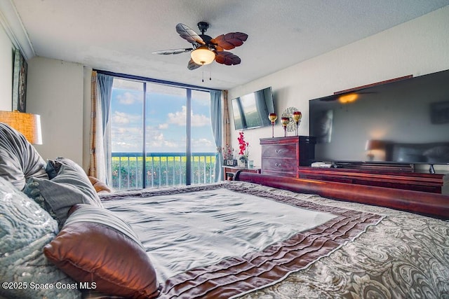 bedroom with access to outside and ceiling fan