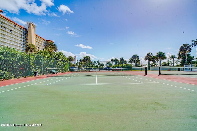 view of sport court with fence
