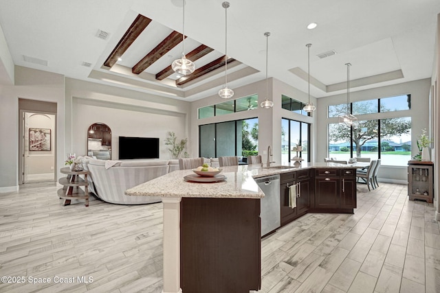 3882 Durksly Dr, Melbourne, FL 32940 - kitchen with a raised ceiling, visible vents, light wood-style flooring, and stainless steel dishwasher