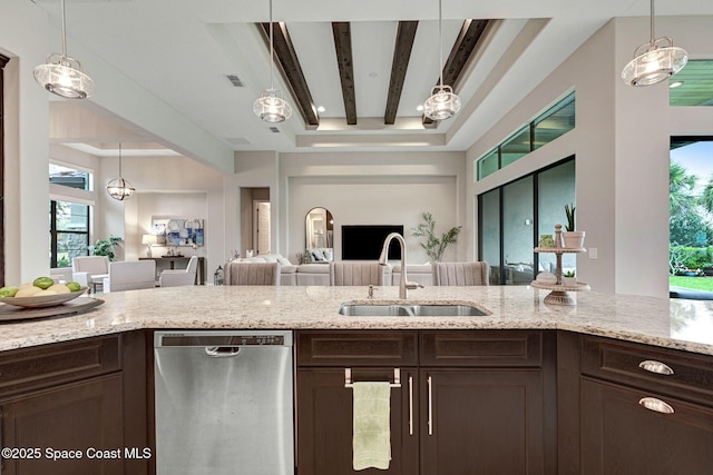 3882 Durksly Dr, Melbourne, FL 32940 - kitchen with visible vents, dishwasher, open floor plan, dark brown cabinets, and a sink