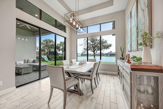 3882 Durksly Dr, Melbourne, FL 32940 - sunroom with a chandelier and a water view