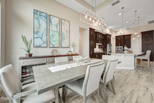 3882 Durksly Dr, Melbourne, FL 32940 - dining area featuring light wood-style floors, visible vents, and recessed lighting