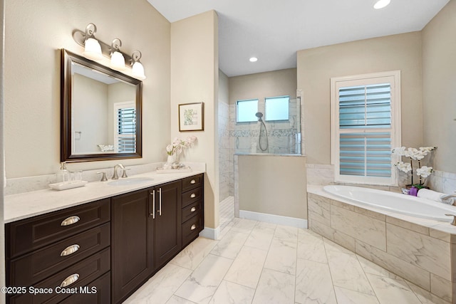 3882 Durksly Dr, Melbourne, FL 32940 - bathroom with a garden tub, marble finish floor, vanity, a walk in shower, and recessed lighting