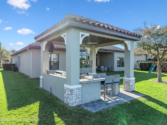3882 Durksly Dr, Melbourne, FL 32940 - view of patio / terrace featuring outdoor dry bar and a playground