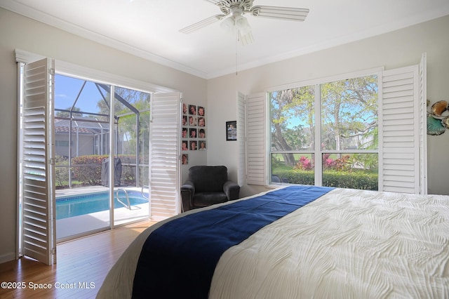 bedroom featuring ornamental molding, access to outside, a ceiling fan, and wood finished floors