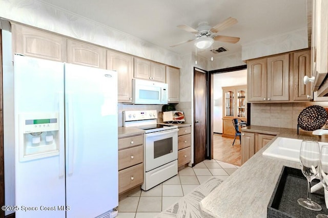 kitchen with ceiling fan, white appliances, visible vents, light countertops, and tasteful backsplash