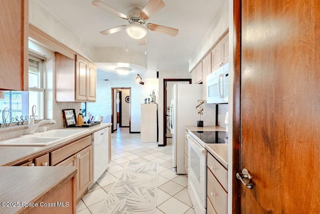 kitchen featuring white appliances, light tile patterned floors, ceiling fan, light countertops, and a sink