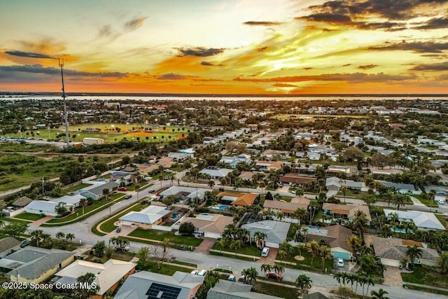 aerial view at dusk with a residential view