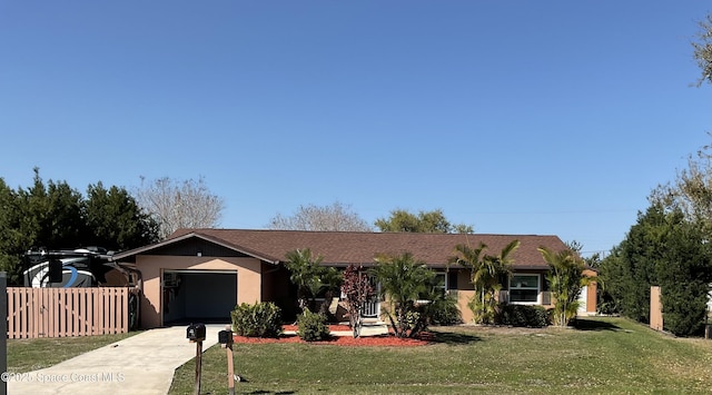 ranch-style home with an attached garage, fence, driveway, stucco siding, and a front yard