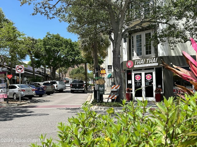 view of street with traffic signs and curbs