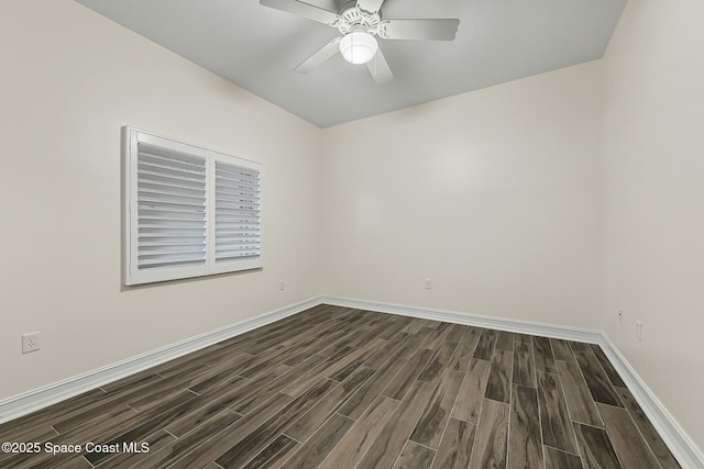 empty room featuring ceiling fan, baseboards, and wood finish floors