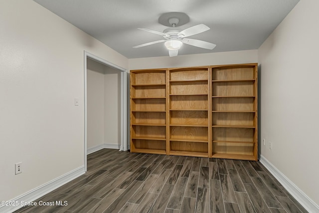 unfurnished room featuring ceiling fan, baseboards, and wood finish floors