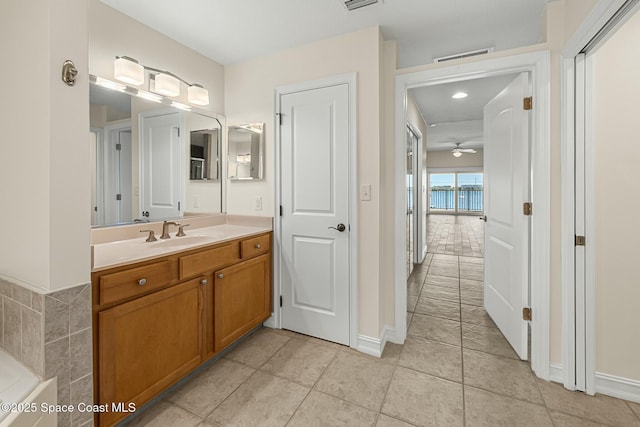 bathroom with visible vents, vanity, and tile patterned floors