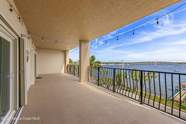 balcony featuring a water view