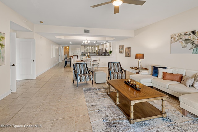 29 Riverside Dr Unit 402, Cocoa, FL 32922 - living room with a ceiling fan, light tile patterned floors, and a chandelier