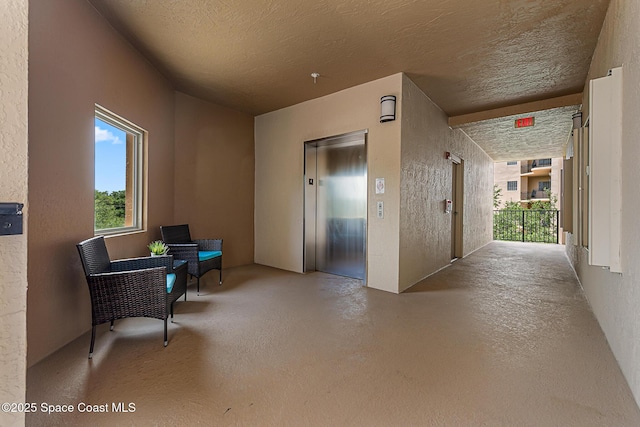 29 Riverside Dr Unit 402, Cocoa, FL 32922 - common area with a textured ceiling and a textured wall