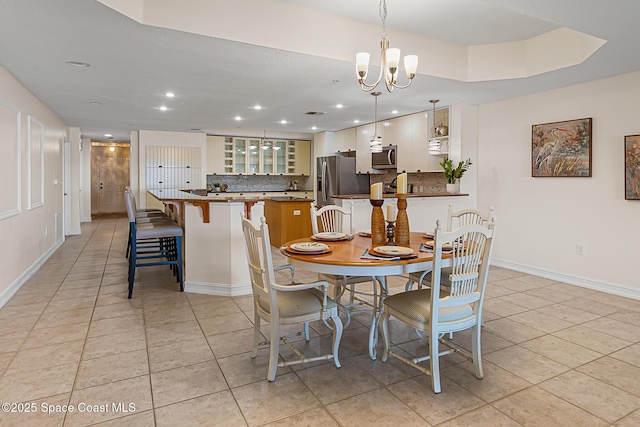 29 Riverside Dr Unit 402, Cocoa, FL 32922 - dining area featuring a chandelier, light tile patterned flooring, and recessed lighting