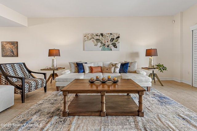 29 Riverside Dr Unit 402, Cocoa, FL 32922 - living room featuring light tile patterned floors and baseboards