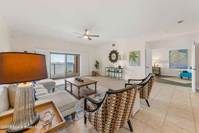 29 Riverside Dr Unit 402, Cocoa, FL 32922 - living area with a ceiling fan and light tile patterned floors