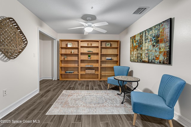 29 Riverside Dr Unit 402, Cocoa, FL 32922 - living area featuring dark wood-style flooring and a ceiling fan