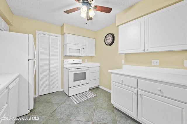 kitchen with white appliances, white cabinetry, light countertops, and a textured ceiling