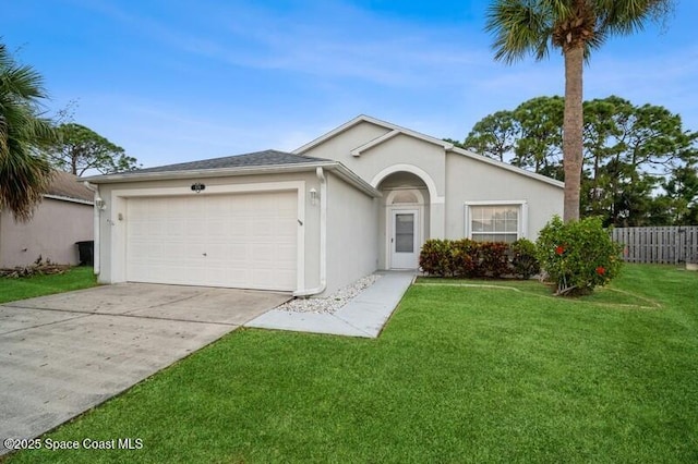 ranch-style home featuring fence, an attached garage, stucco siding, a front lawn, and concrete driveway