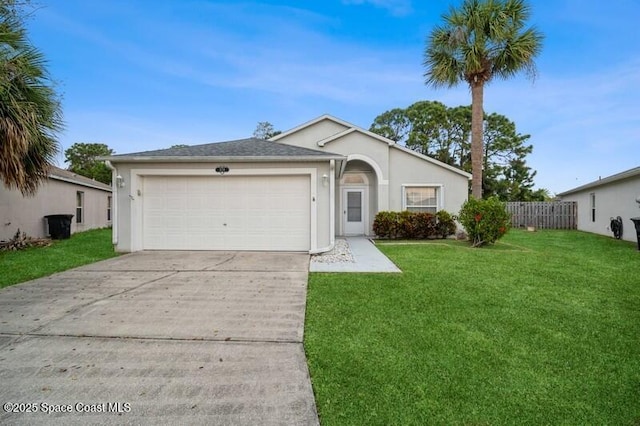 single story home with a front yard, concrete driveway, a garage, and stucco siding