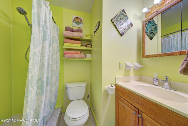 full bathroom featuring baseboards, toilet, a shower with curtain, tile patterned floors, and vanity