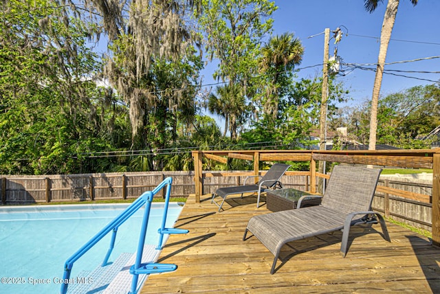 exterior space featuring a deck and fence