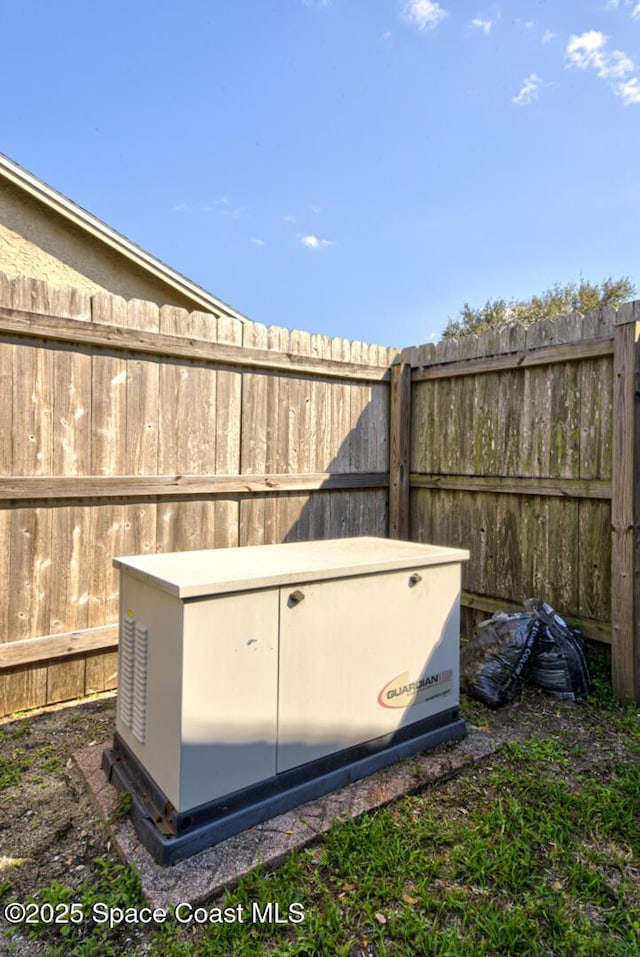 view of storm shelter featuring fence