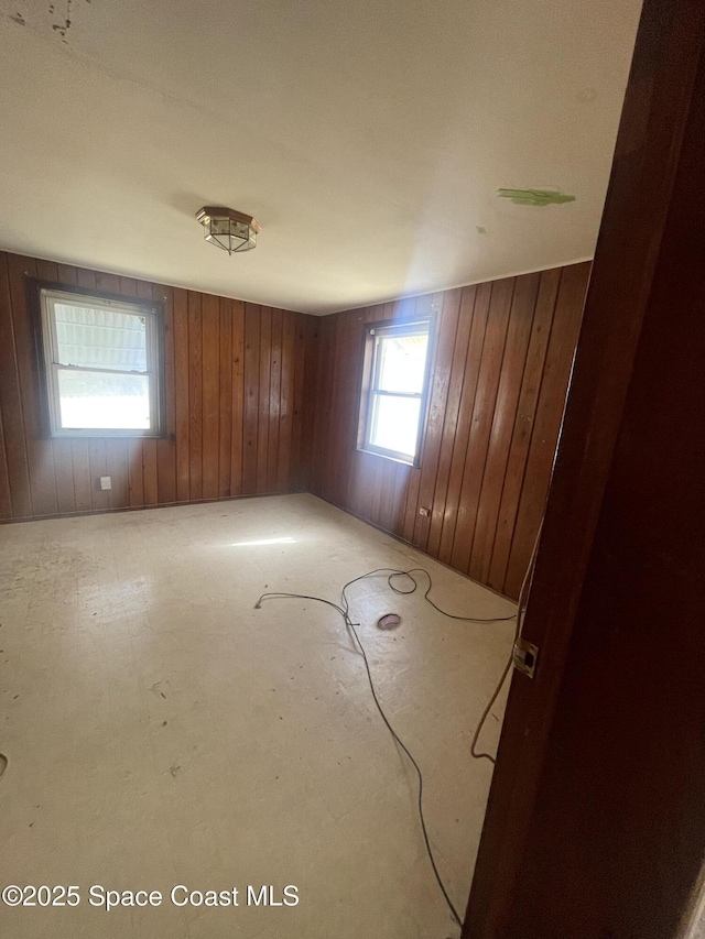 empty room with wood walls