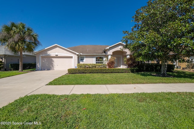 view of front of home featuring a garage, concrete driveway, a front lawn, and stucco siding