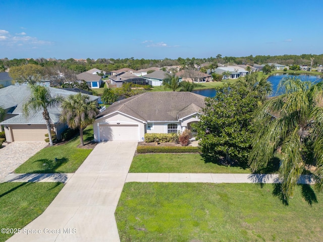 bird's eye view featuring a water view and a residential view