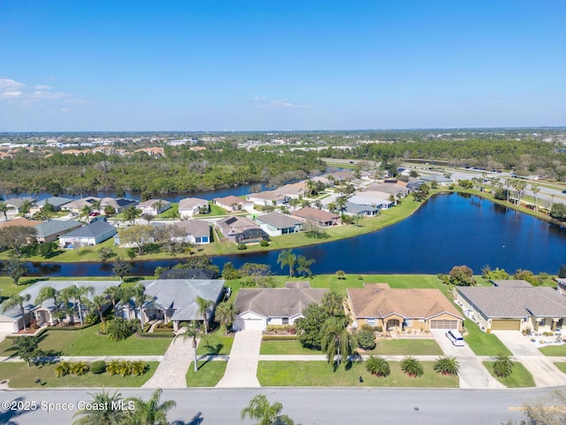 aerial view with a residential view and a water view